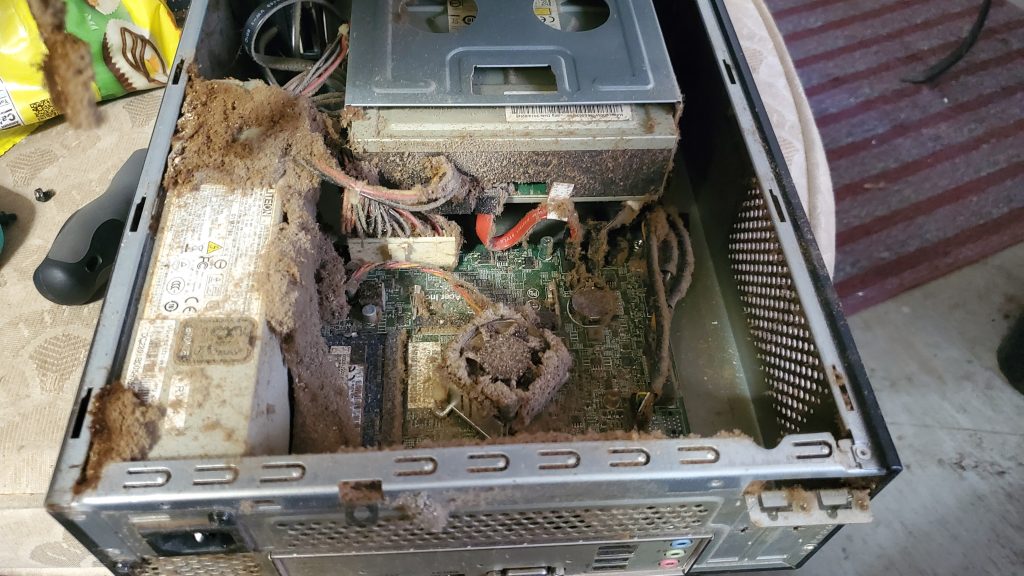 Image of computer tower, full of dust